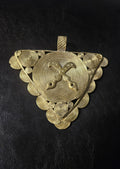 Triangular brass Akofena pendant with raised crossed swords over a large spiral disc, smaller spiral discs around the border, and a textured top hanging loop